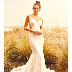 A beautiful new unworn Lilian West timeless wedding dress